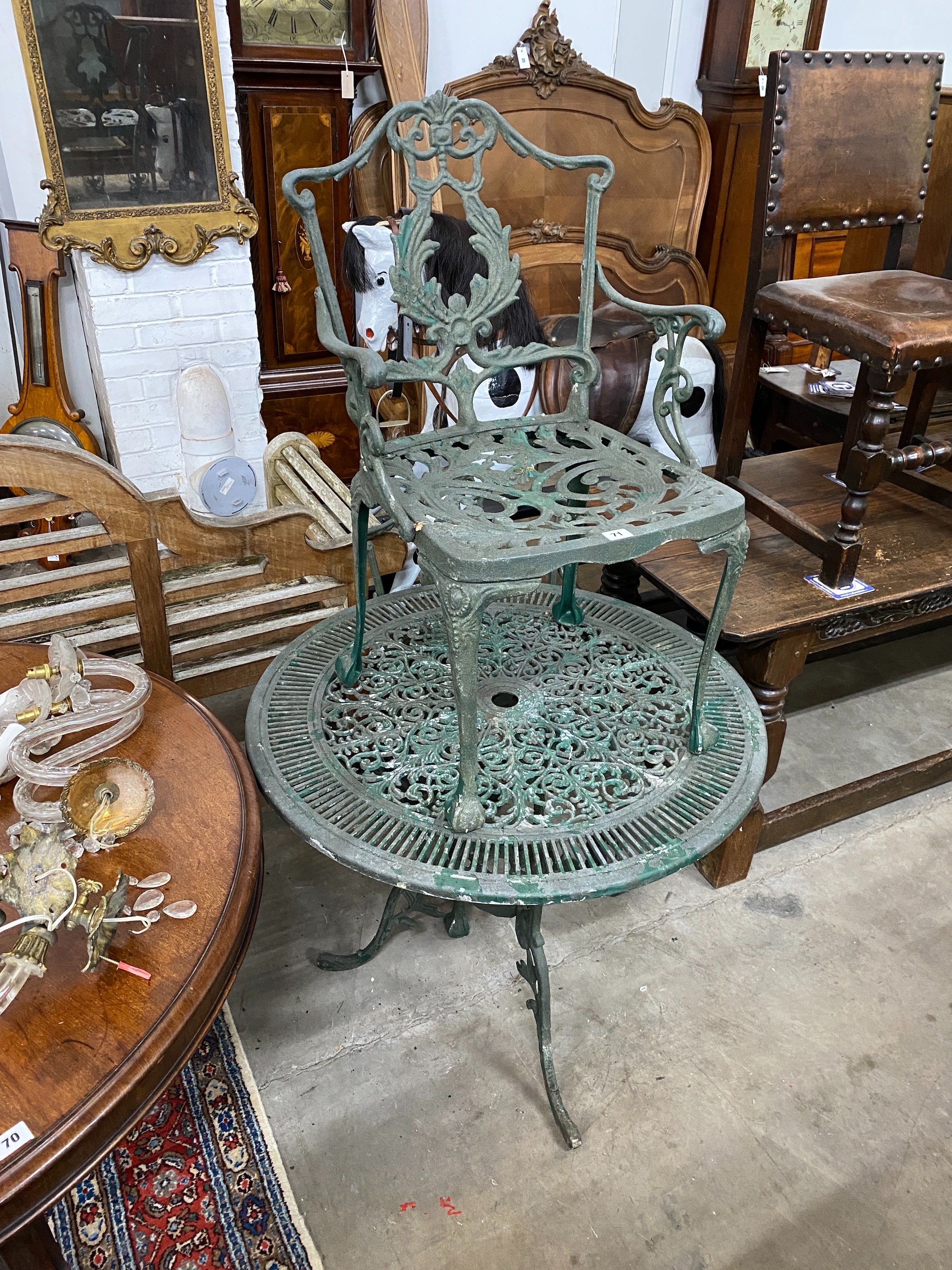 A painted aluminium circular garden table and two chairs, width 80cm, height 69cm